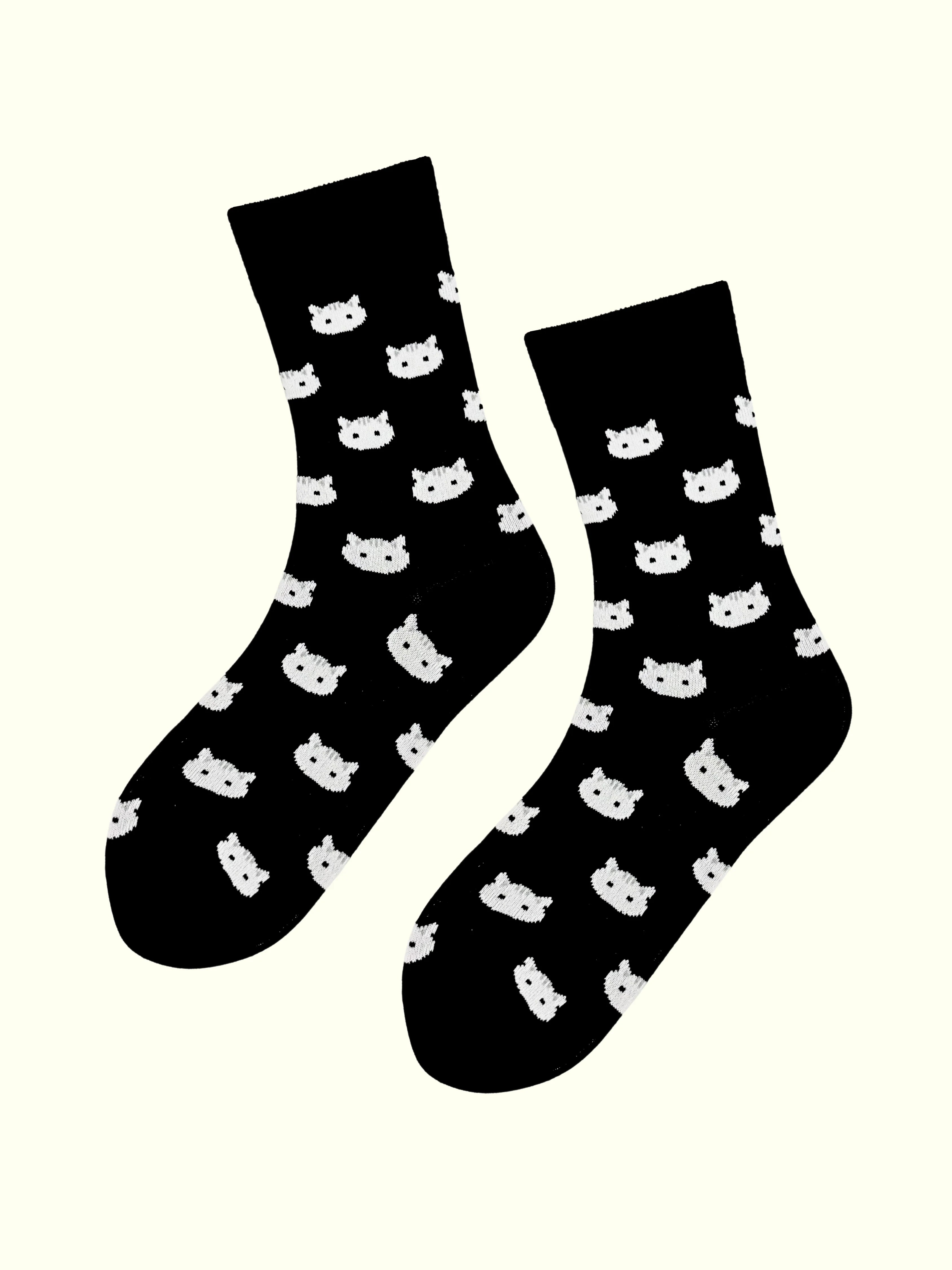 A pair of white cat face socks