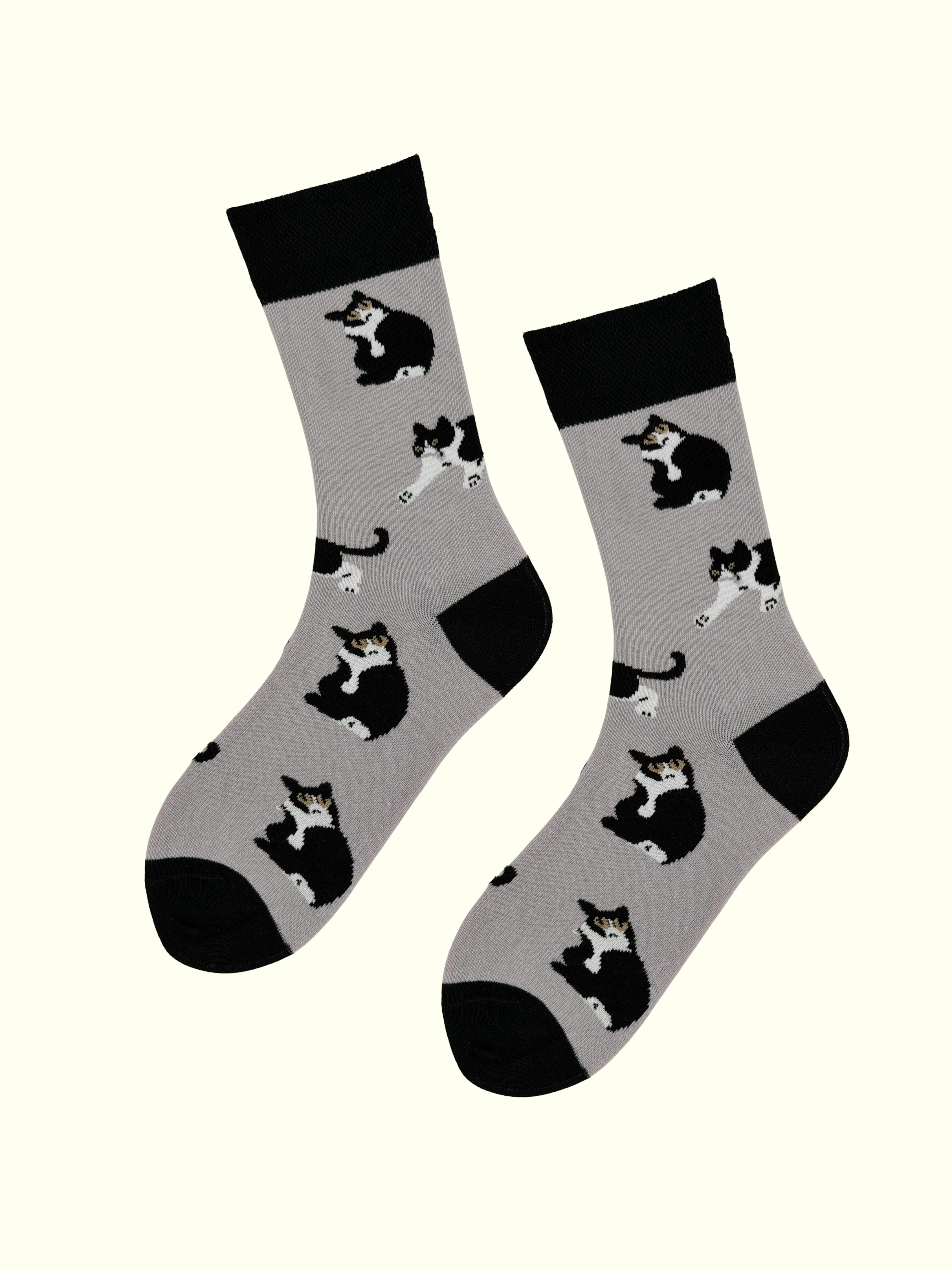 A pair of tuxedo cat socks