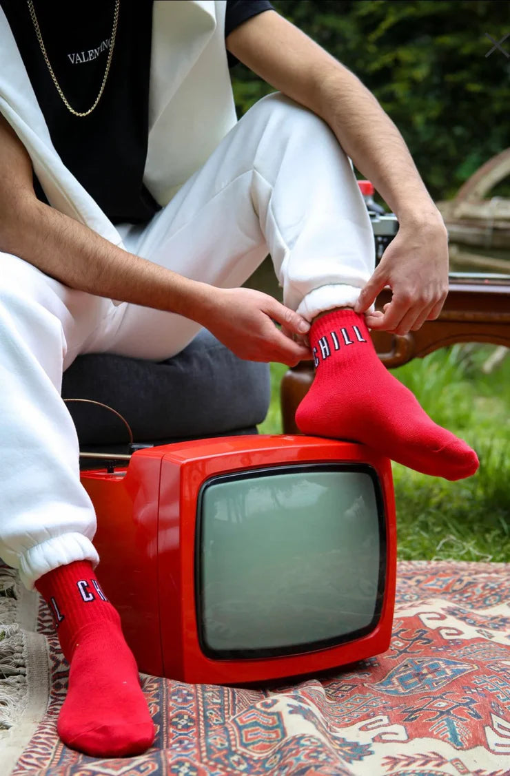 A model wearing red chill socks