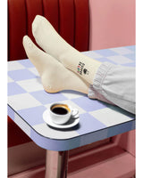 A model wearing coffee is life socks