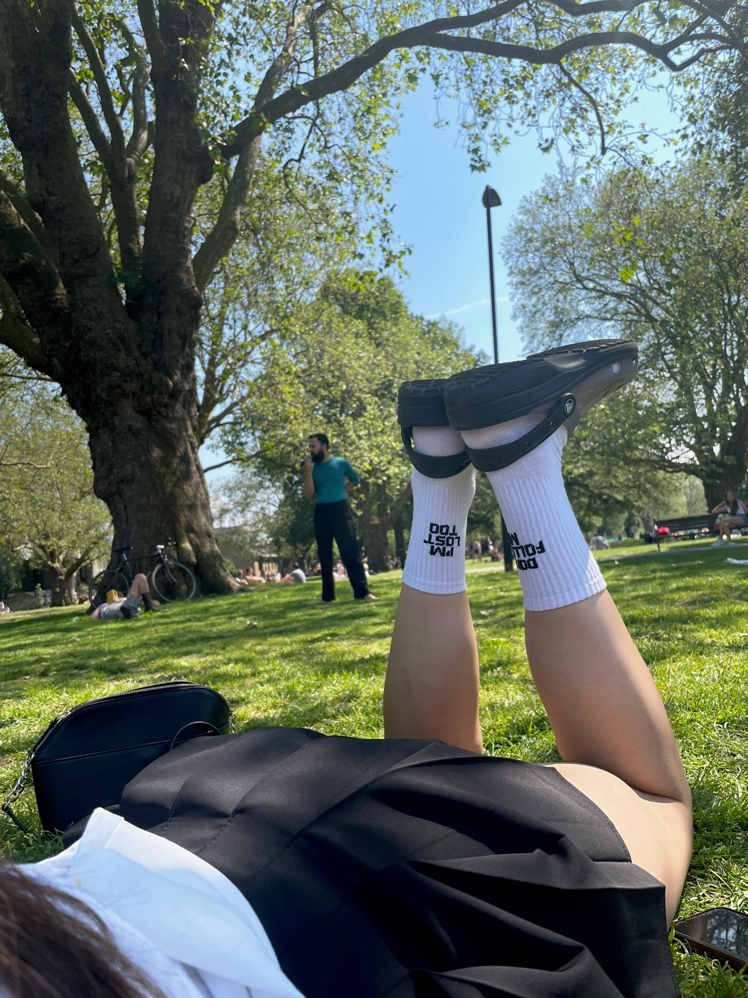 A model wearing dont follow me i am lost socks