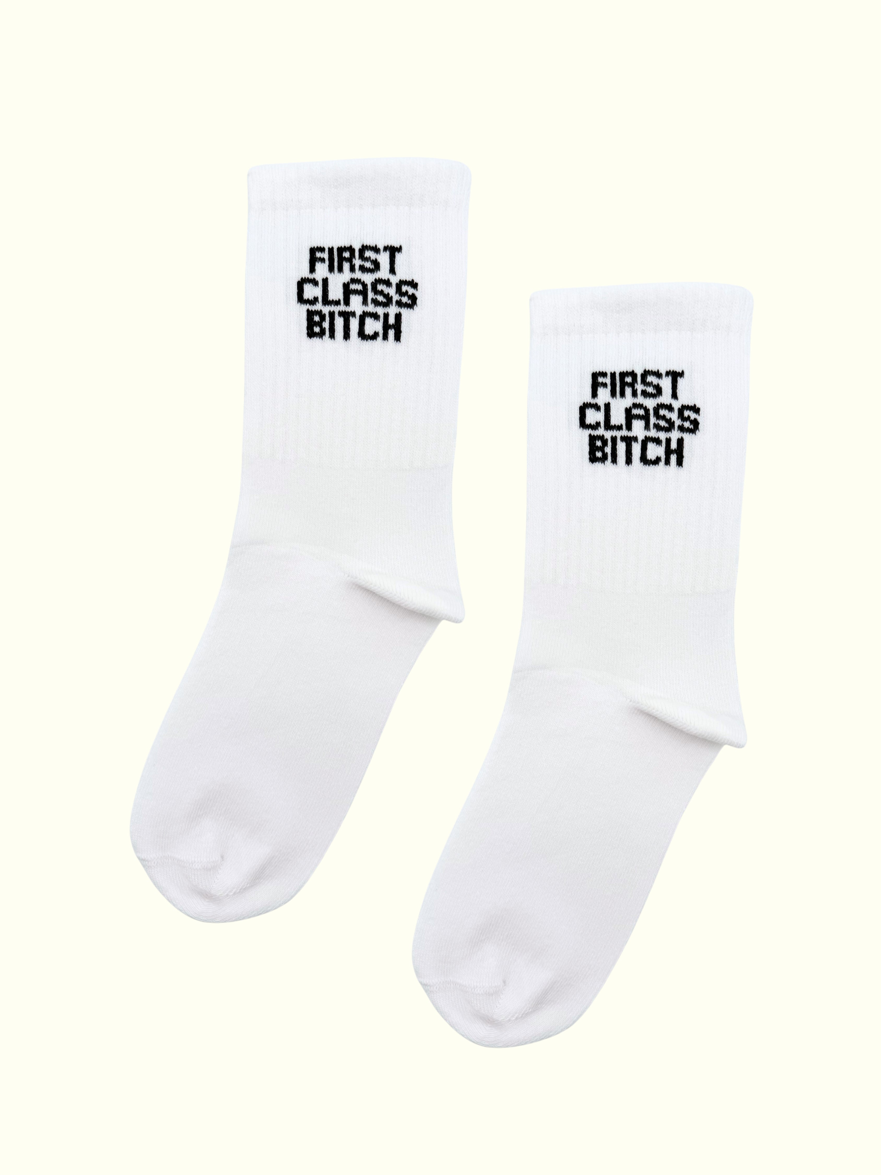 A pair of first class bitch socks
