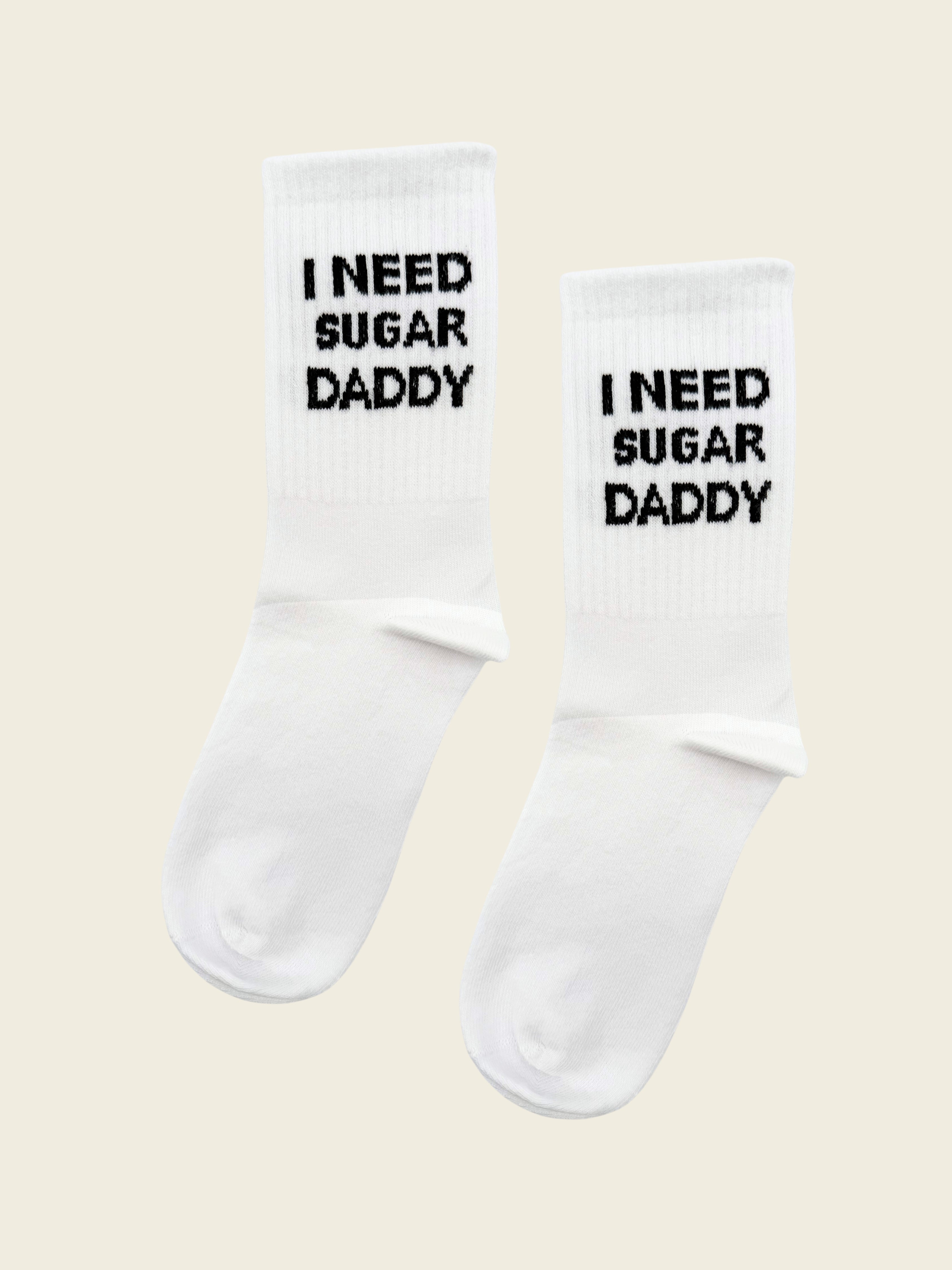 A pair of I need sugar daddy socks