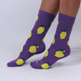 A model wearing lemon purple socks