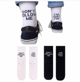 Two pairs of socks in black and white