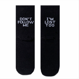 A black pair of dont follow me i am lost too socks