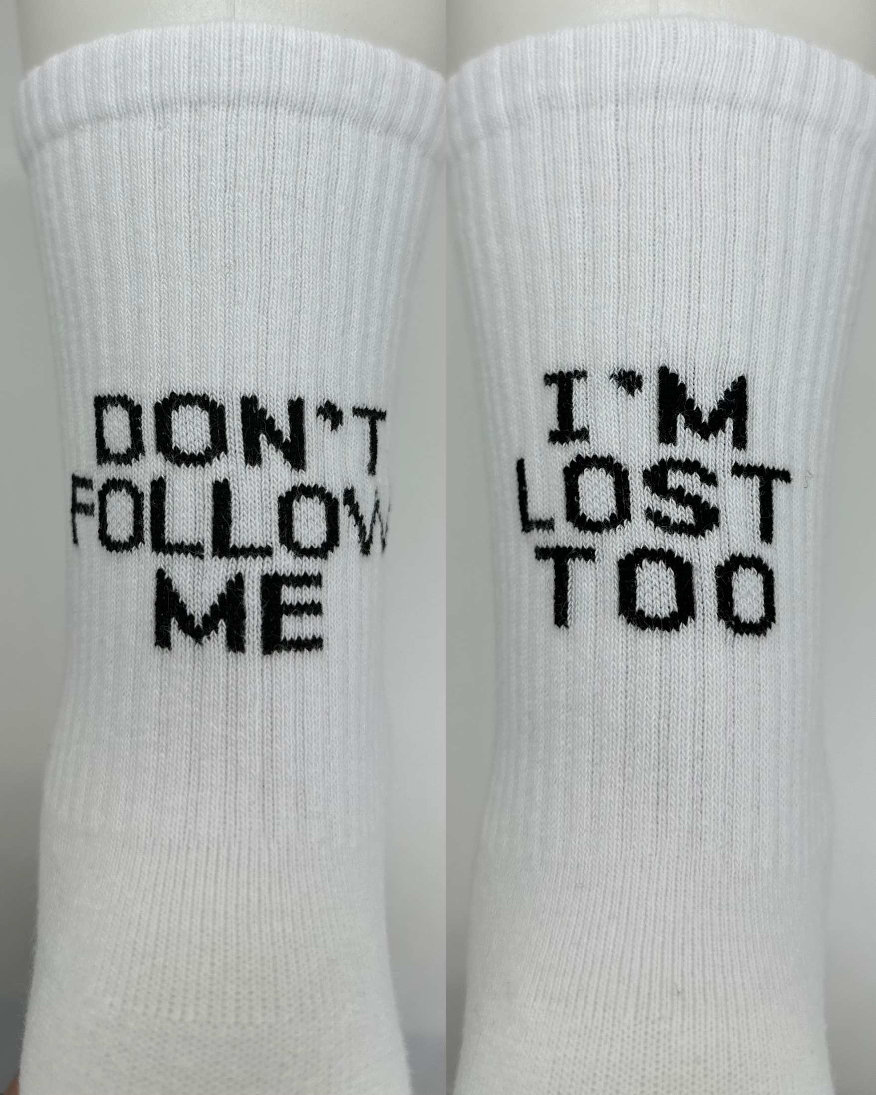 Close look of dont follow me i am lost too socks